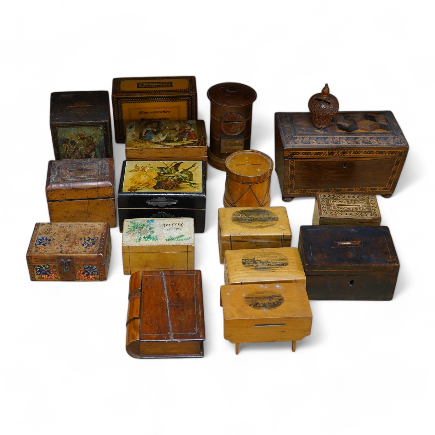 A 19th century Tunbridgeware tea caddy, 20cm wide, 11cm high, a Coquilla nut miniature money box and a collection of mixed decorative and novelty wooden money boxes (17). Condition - poor to fair